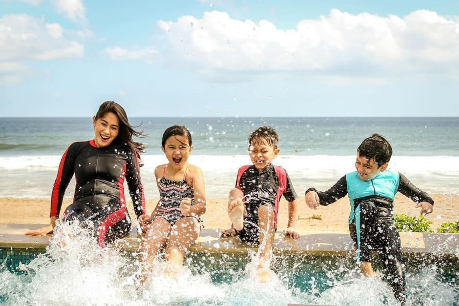 Image of a family splashing in the water